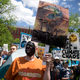 A protestor holds a sign during a rally against offshore drilling in Lafayette Square near the White House in May 2016 (Photo: AP)